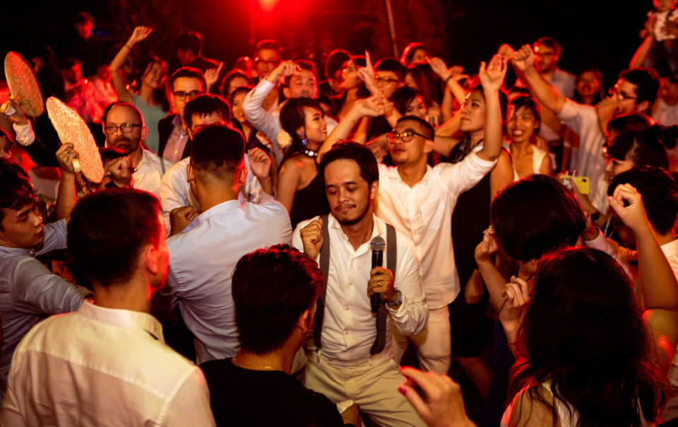 Wedding reception wild dance party with the groom at the centre.