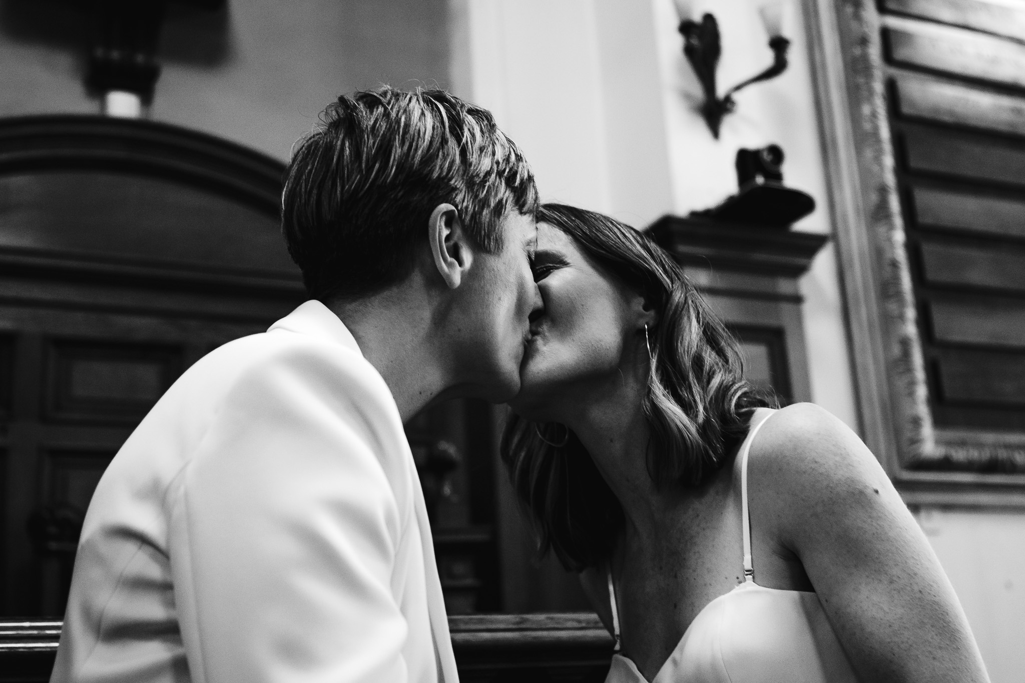 Gemma and Natalie kiss during their wedding ceremony at Brighton Town Hall.