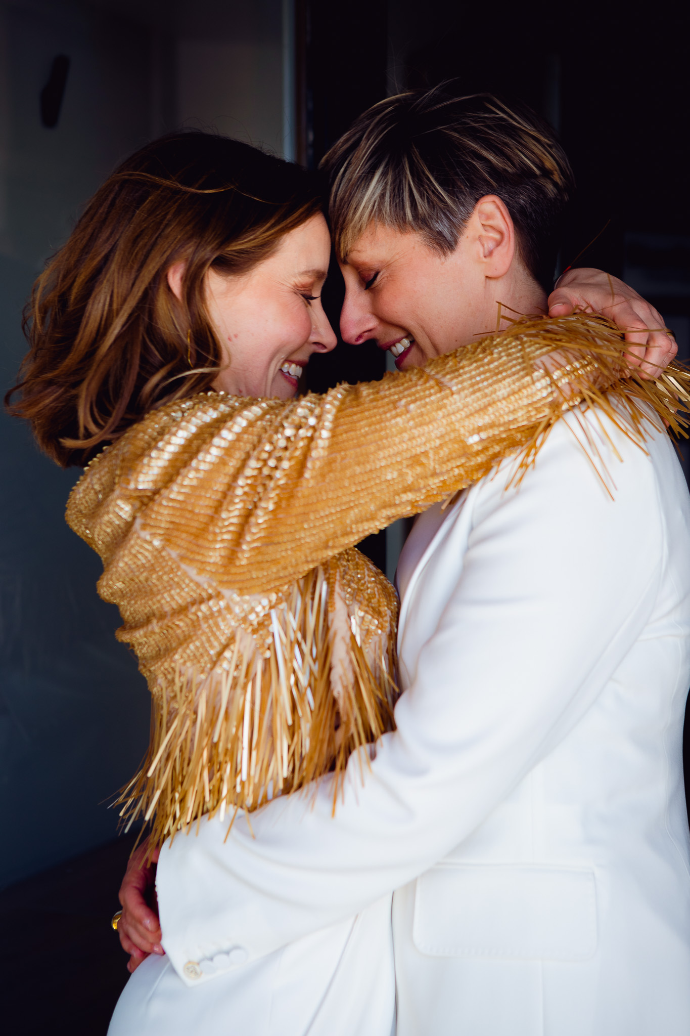 Gemma and Natalie hold each other and touch foreheads as they pose for couple shots in the Brighton lanes.