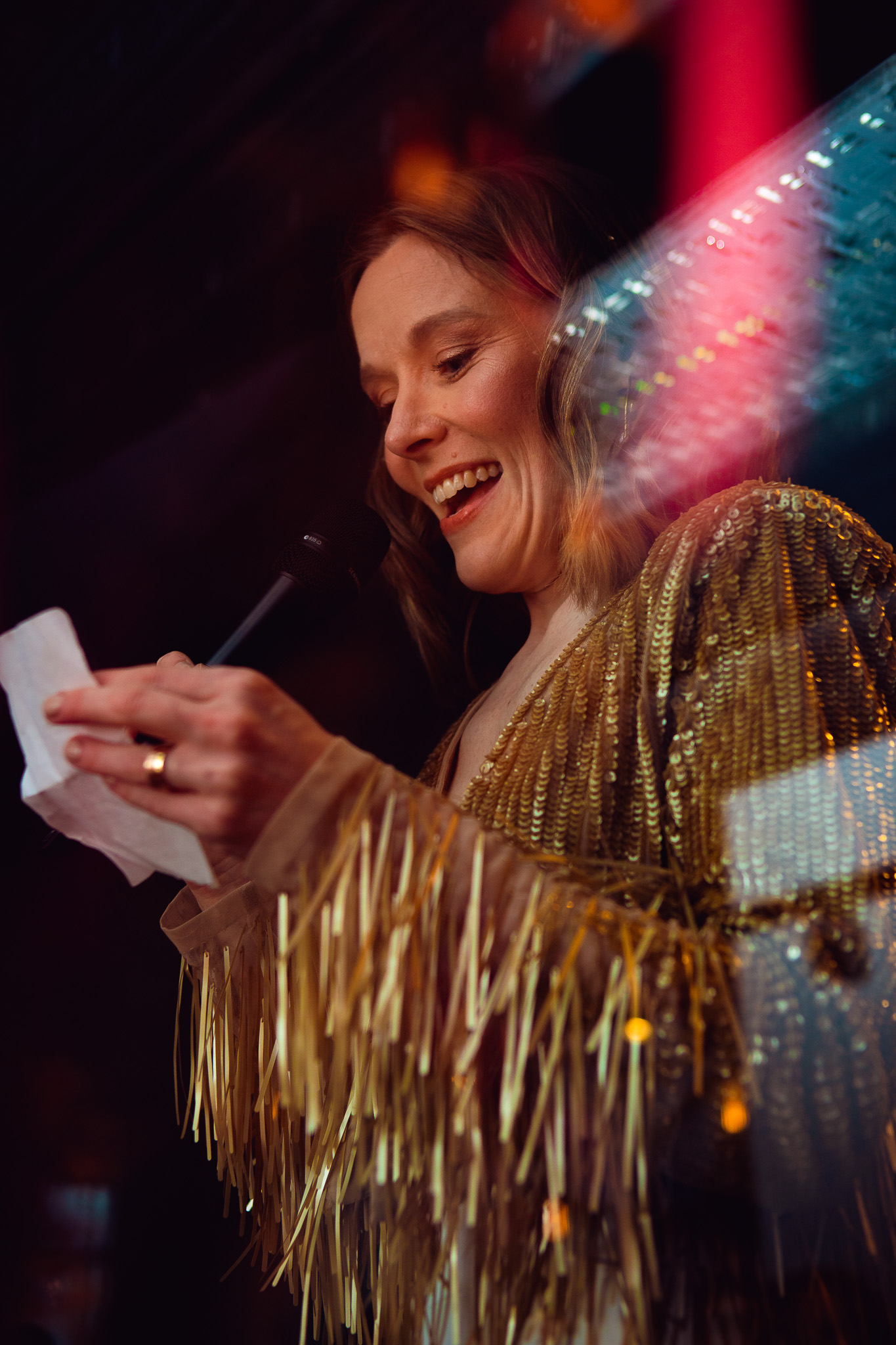 Gemma reads of her wedding speech from a piece of paper.