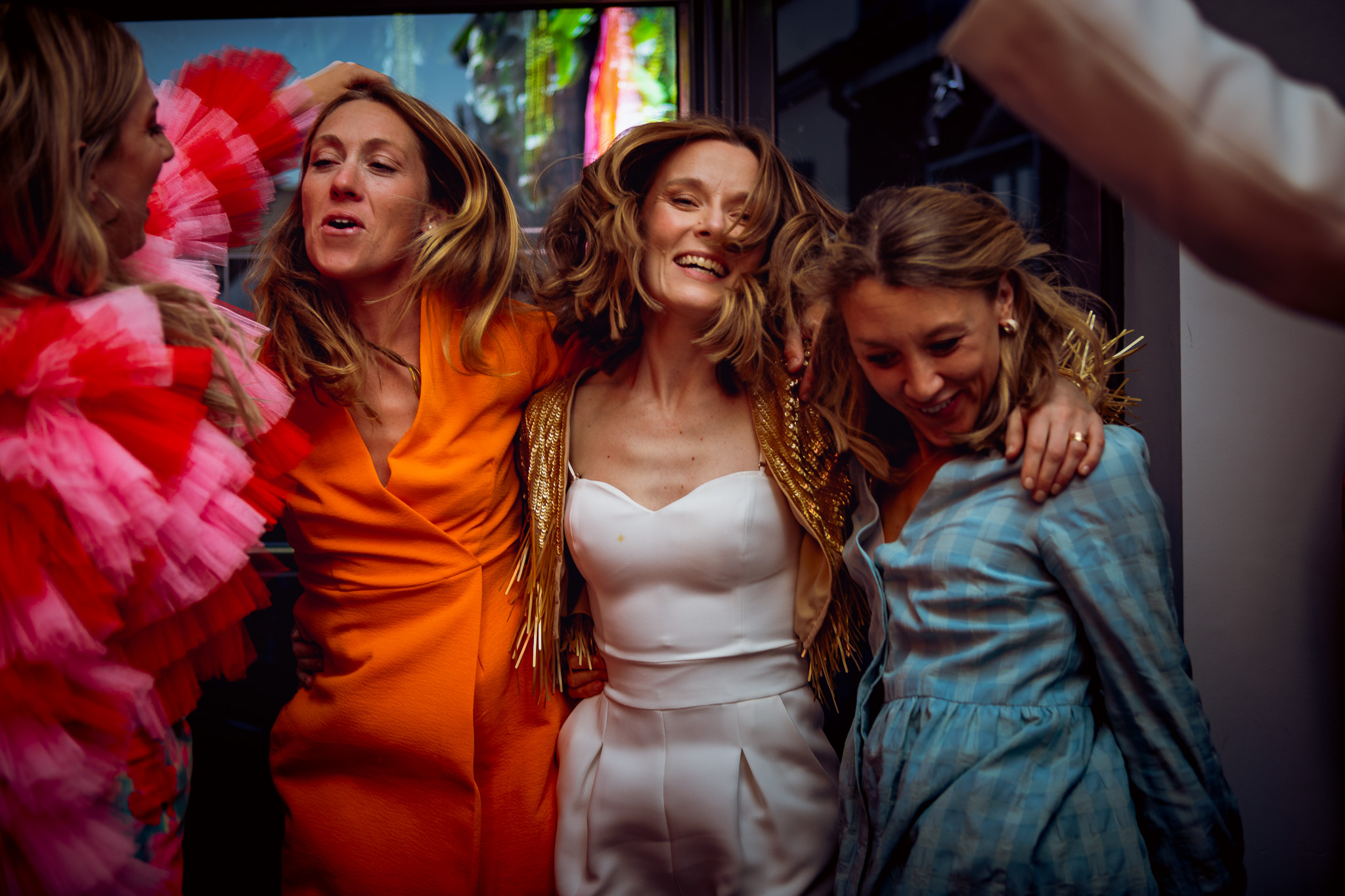 Gemma dances with three of her colourfully dressed girlfriends.