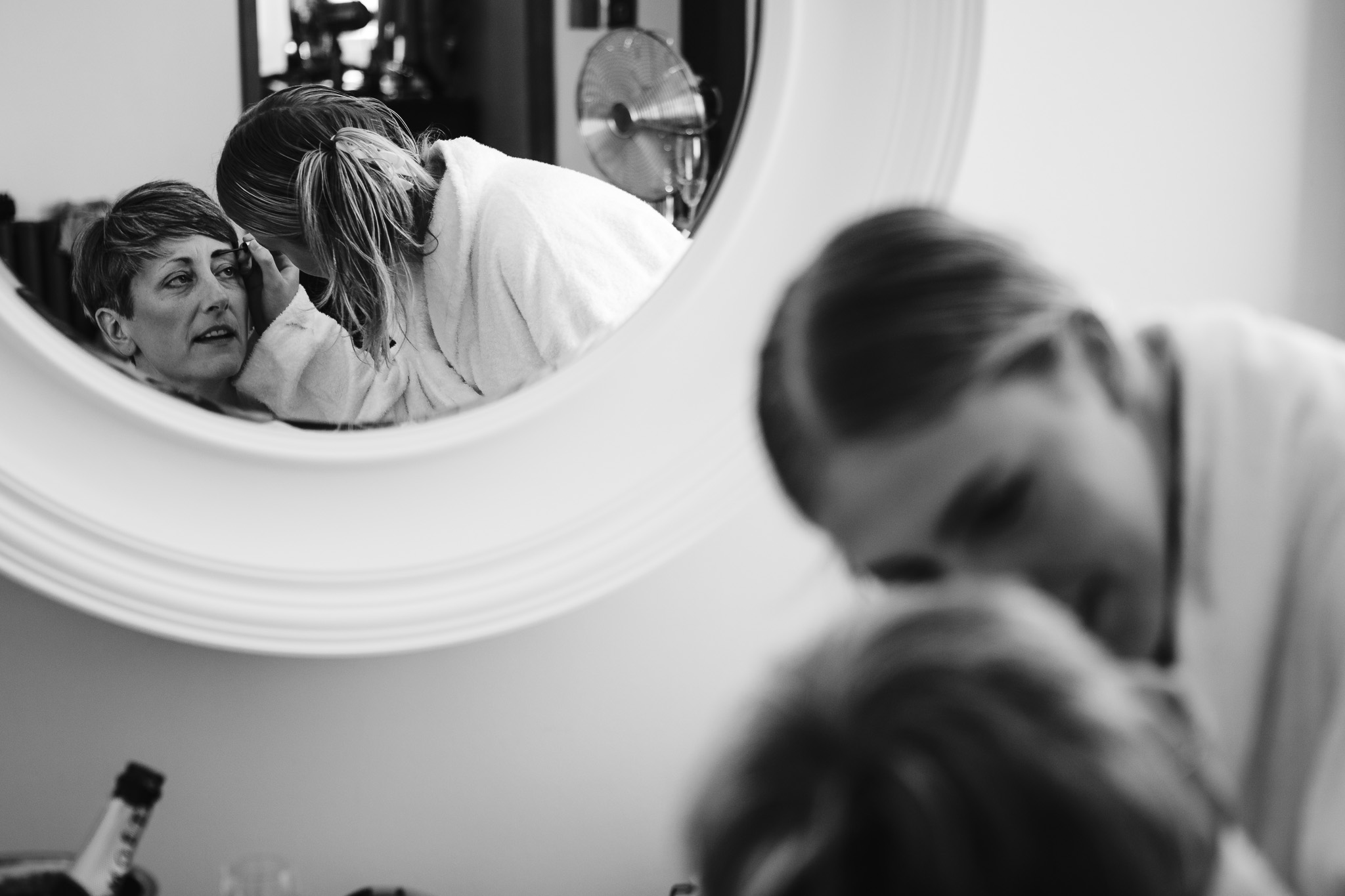 Reflection of Natalie getting her makeup done by her niece in preparation for her wedding day.